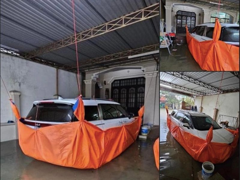 Sử dụng bạt dày thủ công để chống ngập cho xe